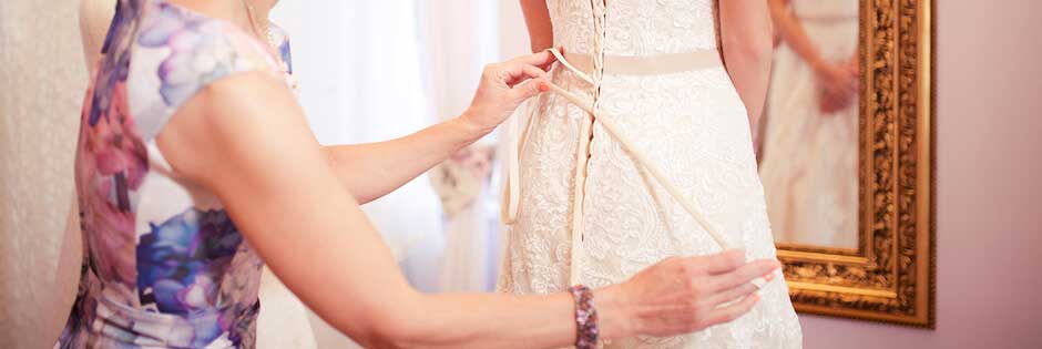 Dress fitting in a bridal shop