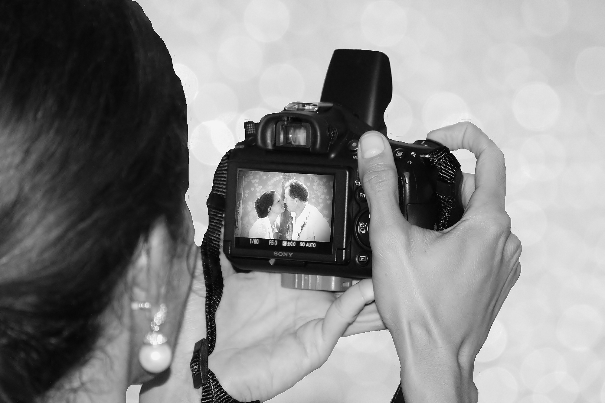 Photographer taking photo at wedding