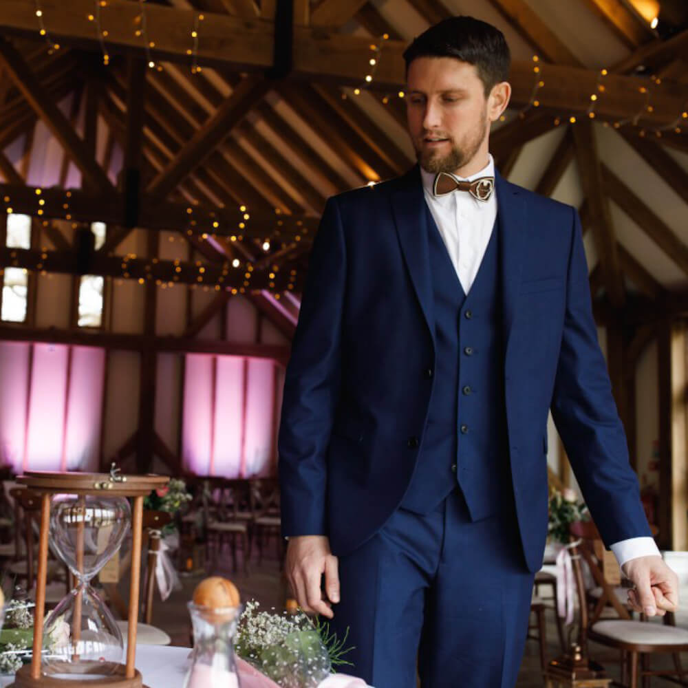 Wedding groom with wooden Marvel bowtie